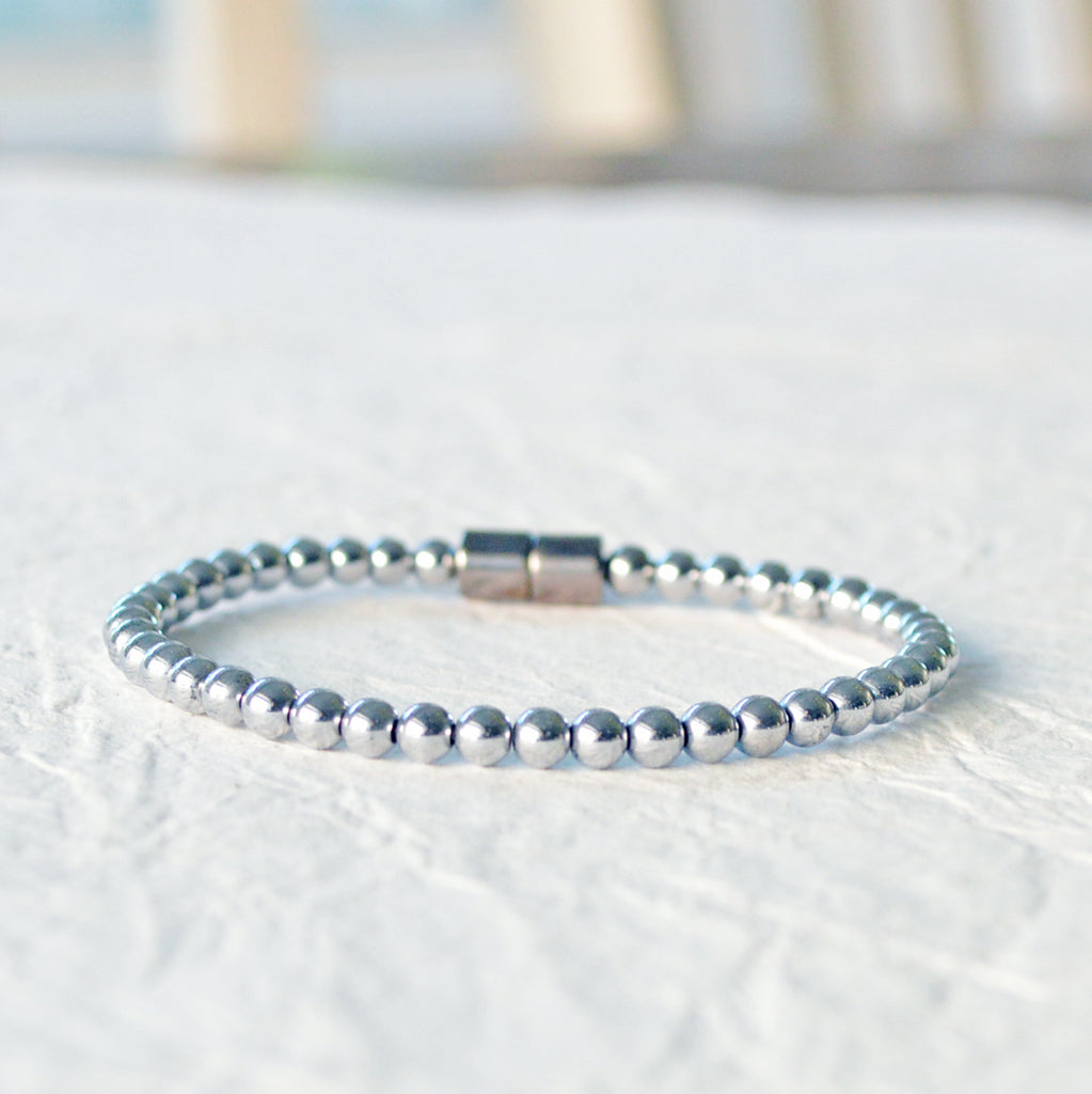Magnetic bracelet handcrafted with silver metallic magnetic hematite beads. It is secured with a strong magnetic clasp and can be worn as a magnetic bracelet or magnetic anklet.