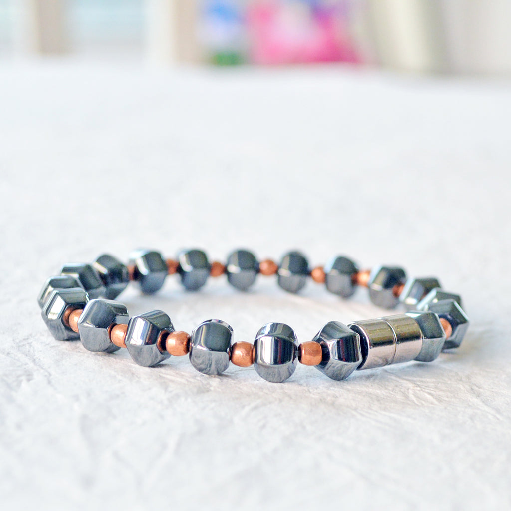 Magnetic bracelet handcrafted with black high power magnetic beads and genuine copper beads. It is secured with a strong and easy-to-use magnetic clasp.
