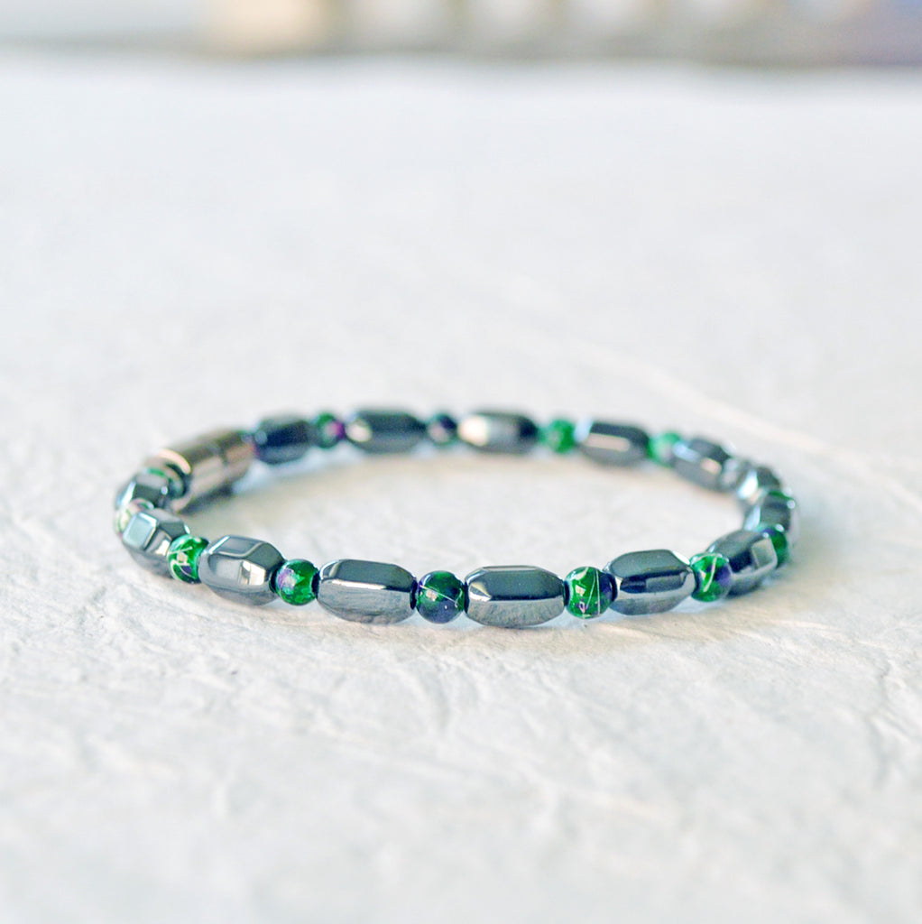 Magnetic bracelet handcrafted with black hematite and green picasso hematite magnetic beads. It is secured with a strong magnetic clasp. Wear as a magnetic bracelet or magnetic ankle bracelet.