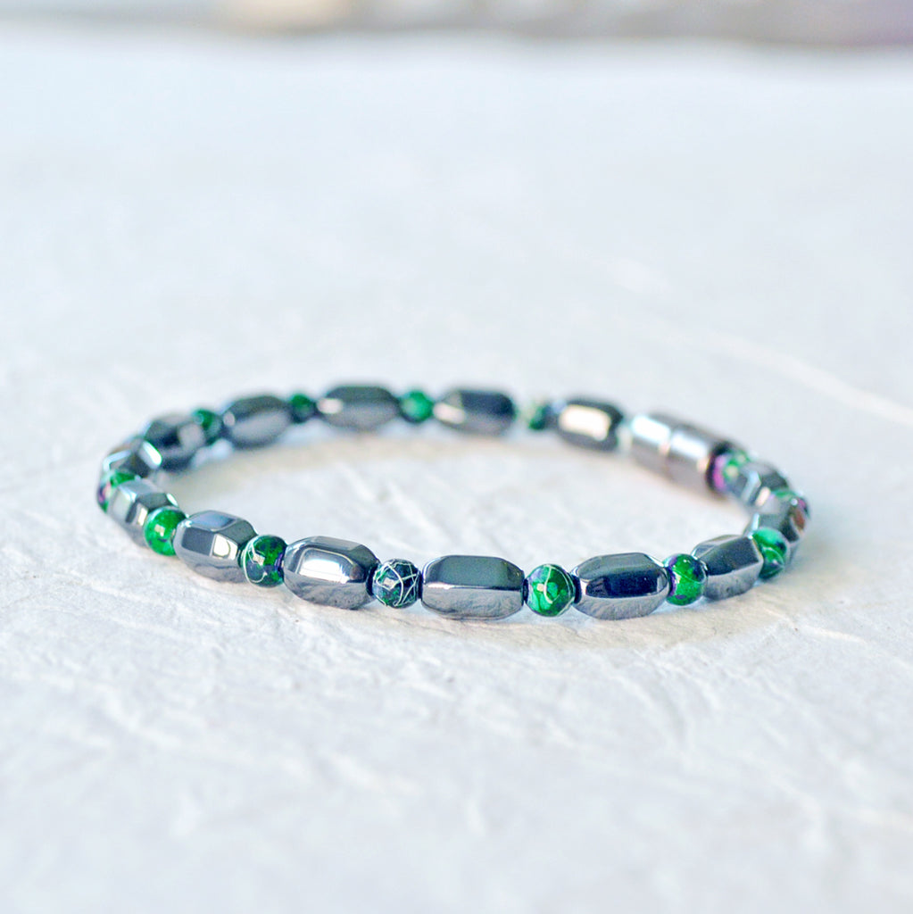 Magnetic bracelet handcrafted with black hematite and green picasso hematite magnetic beads. It is secured with a strong magnetic clasp. Wear as a magnetic bracelet or magnetic ankle bracelet.