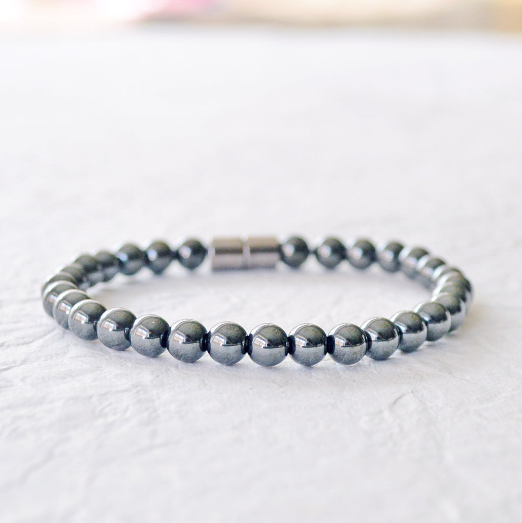 Black magnetic bracelet handcrafted with high power black magnetic hematite beads. Secured with a strong magnetic clasp. Can be worn as a magnetic bracelet or magnetic ankle bracelet.