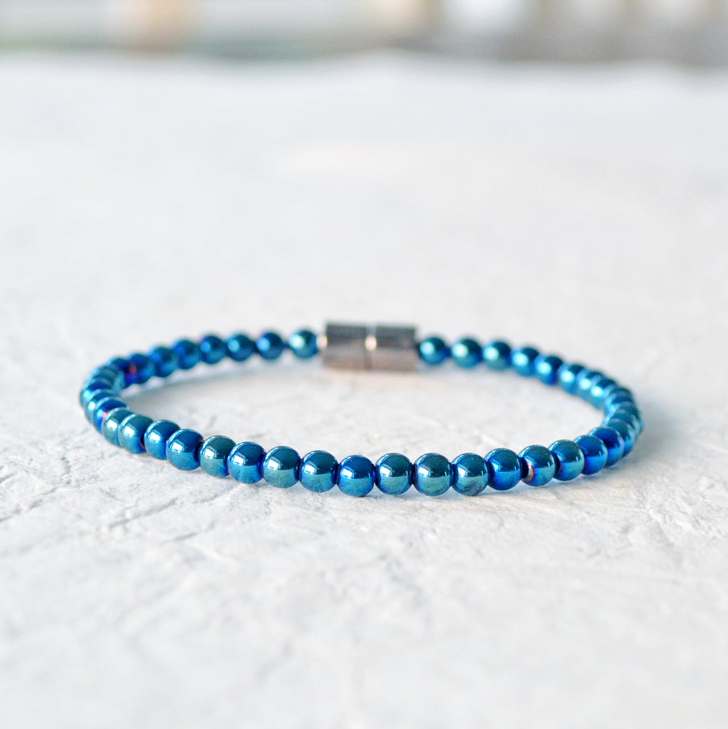 Metallic Magnetic bracelet handcrafted with blue metallic hematite magnetic beads. It is secured with a strong rare earth magnetic clasp. Wear as a magnetic bracelet or ankle bracelet.