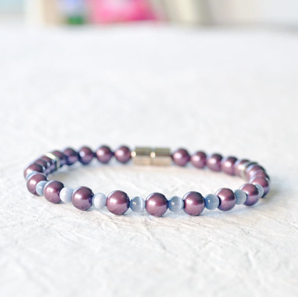 Magnetic bracelet handcrafted with burgundy pearl hematite magnetic beads and grey cat's eye beads. Secured with a strong magnetic clasp. Wear as a magnetic bracelet or magnetic ankle bracelet.