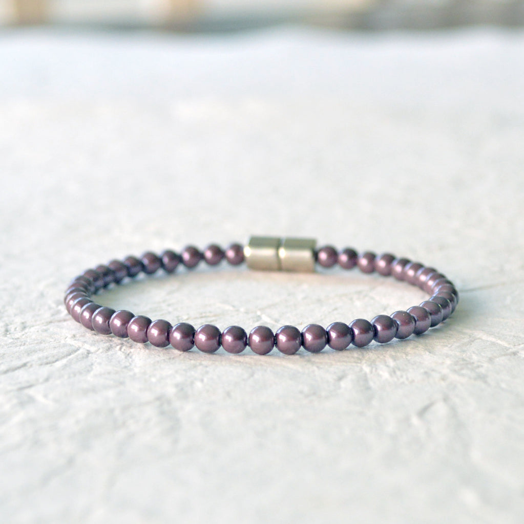 Magnetic bracelet handcrafted with burgundy pearl hematite magnetic beads. It is secured with a strong magnetic clasp and can be worn as a magnetic anklet or magnetic bracelet.