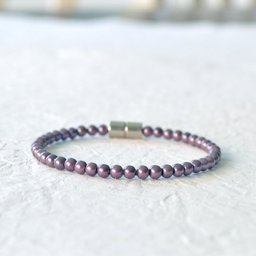Magnetic bracelet handcrafted with burgundy pearl hematite magnetic beads. It is secured with a strong magnetic clasp and can be worn as a magnetic anklet or magnetic bracelet.