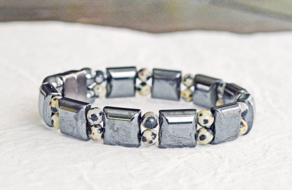Double strand magnetic bracelet is handcrafted with black square magnetic hematite beads and small round dalmatian jasper beads. This magnetic bracelet is secured with a strong and easy-to-use magnetic clasp.
