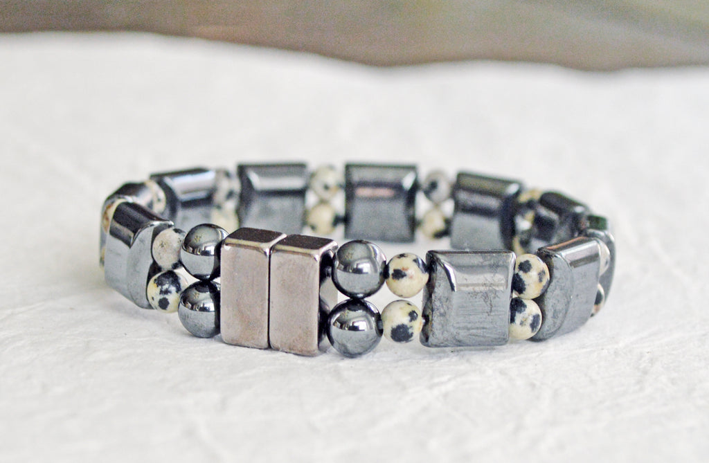 Double strand magnetic bracelet is handcrafted with black square magnetic hematite beads and small round dalmatian jasper beads. This magnetic bracelet is secured with a strong and easy-to-use magnetic clasp.