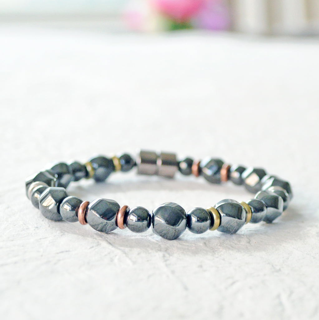 Magnetic bracelet handcrafted with black high power magnetic hematite beads and metal spacer beads. Secured with a strong magnetic clasp.