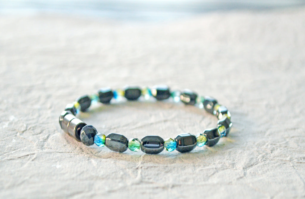 Magnetic bracelet is handcrafted with alternating black high power magnetic hematite beads and blue/green czech glass fire polished beads. It is secured with a strong magnetic clasp and makes a pretty magnetic bracelet or magnetic anklet.