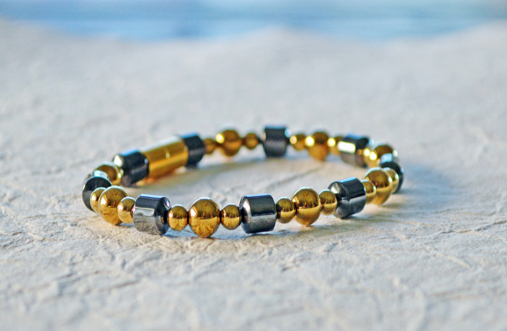 Magnetic bracelet handcrafted with gold and black hematite magnetic beads. It is secured with a strong and easy-to-use magnetic clasp.