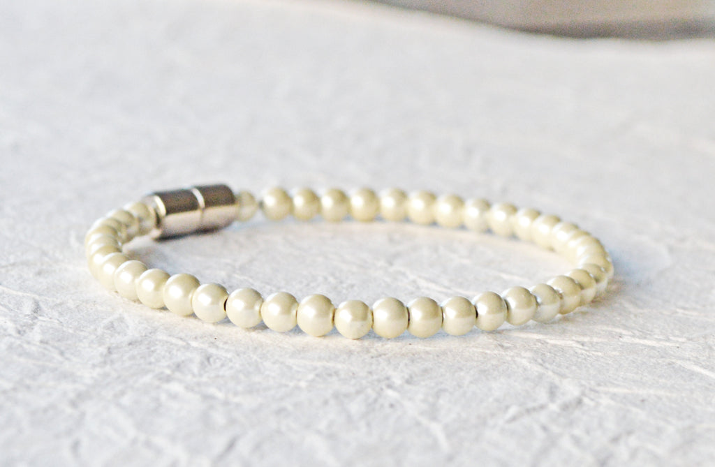 Magnetic bracelet handcrafted with cream pearl hematite magnetic beads and secured with a strong and easy-to-use magnetic clasp.