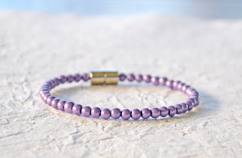 Magnetic bracelet handcrafted with lavender pearl hematite magnetic beads. It is secured with a strong and easy-to-use magnetic clasp.