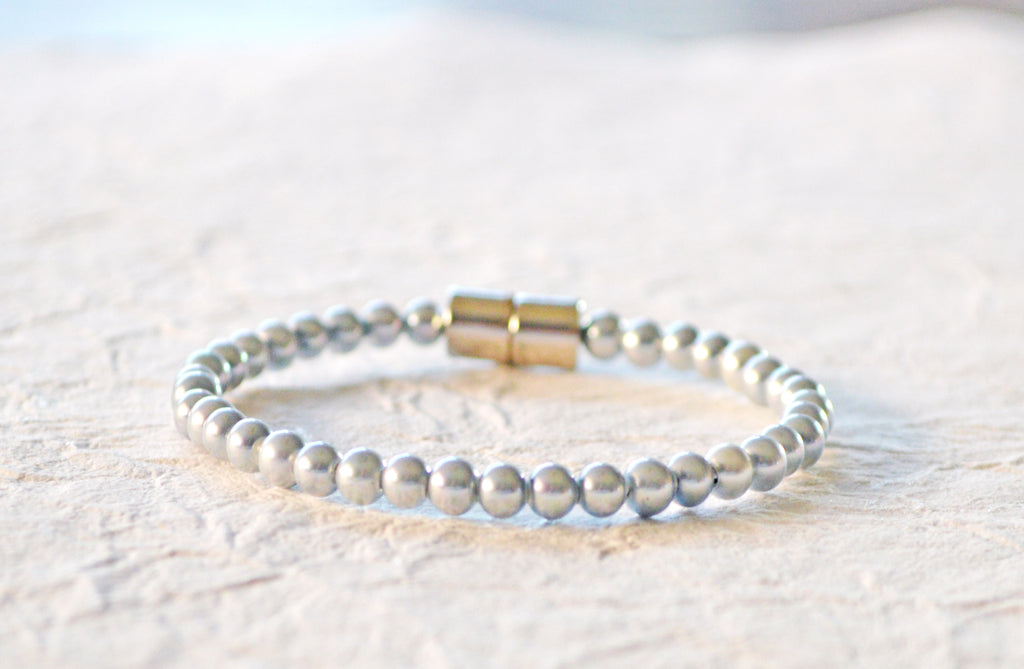 Magnetic bracelet handcrafted with silver pearl hematite magnetic beads. It is secured with a strong and easy-to-use magnetic clasp.