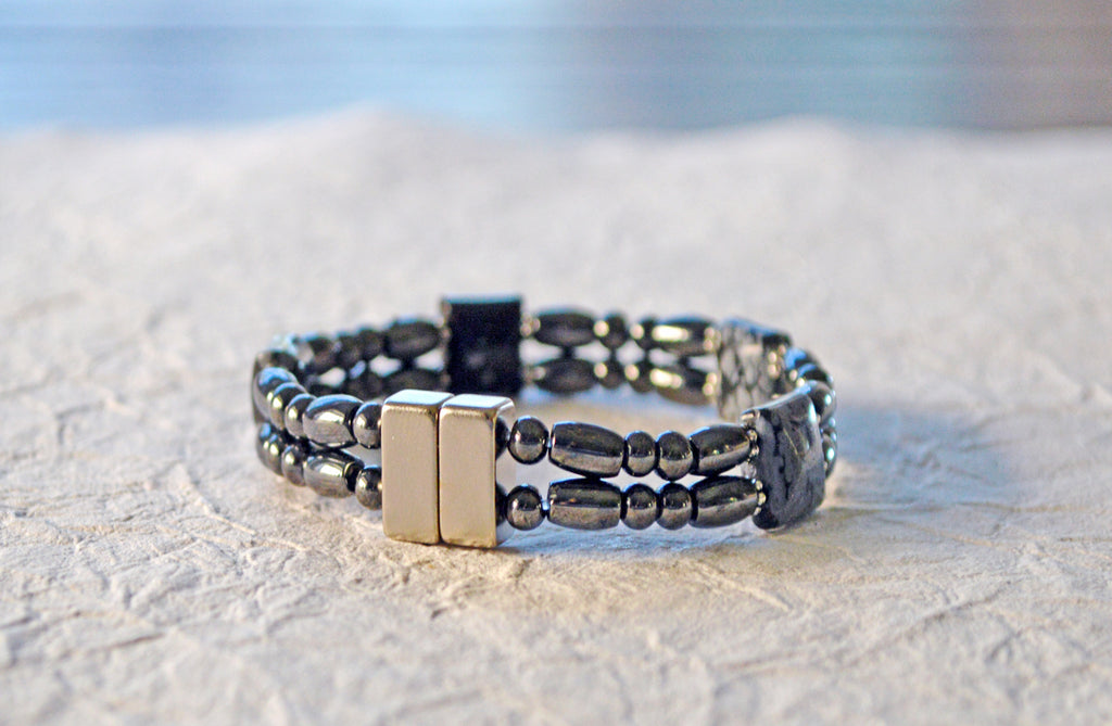 Magnetic bracelet handcrafted with black high power magnetic hematite beads and snowflake obsidian gemstone beads. It is secured with a strong and easy-to-use magnetic clasp.