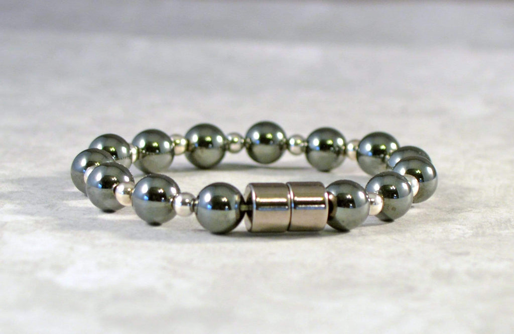 Magnetic bracelet handcrafted with alternating black magnetic hematite beads and sterling silver beads. It is secured with a strong and easy-to-use magnetic clasp.
