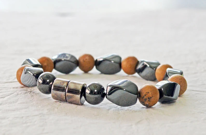 Magnetic bracelet is handcrafted with alternating black high power magnetic hematite beads and grain stone beads. It is secured with a strong and easy-to-use magnetic clasp.