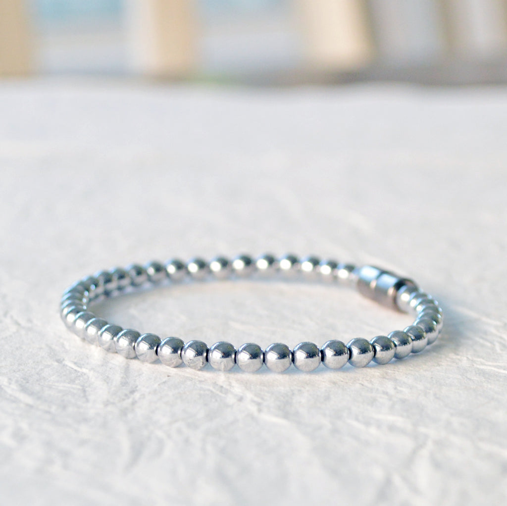 Magnetic bracelet handcrafted with silver metallic magnetic hematite beads. It is secured with a strong magnetic clasp and can be worn as a magnetic bracelet or magnetic anklet.