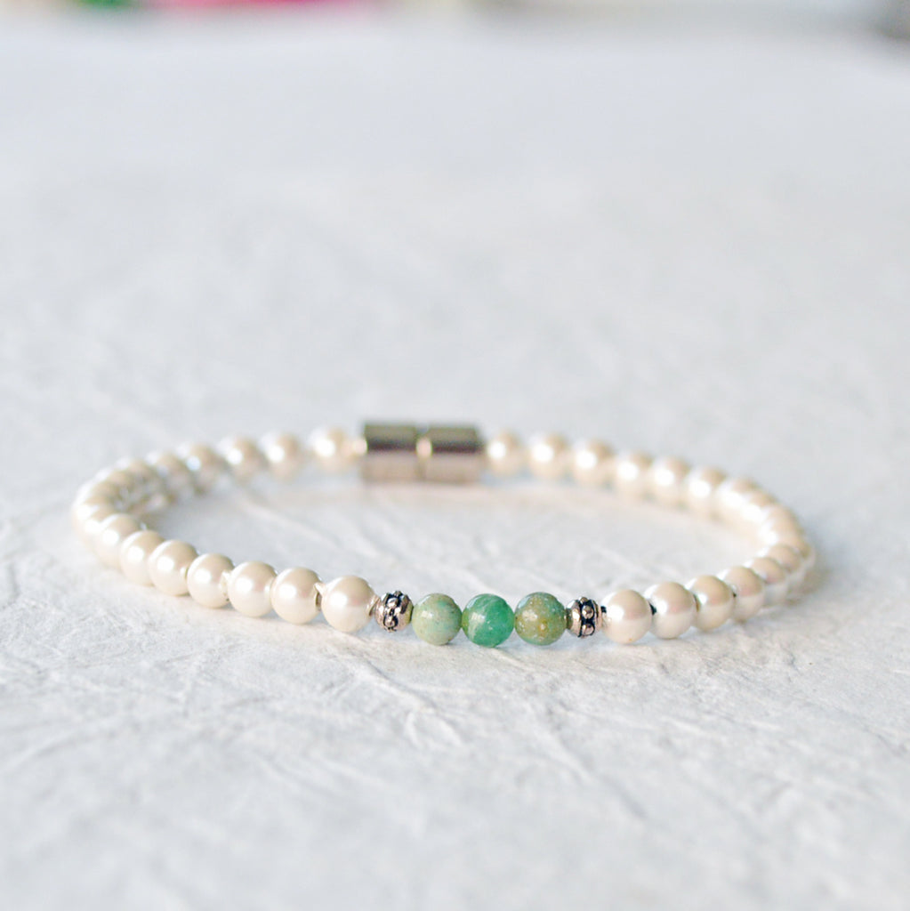 Magnetic bracelet handcrafted with cream pearl hematite magnetic beads with african jade gemstone beads in the center. Secured with a strong and easy-to-use magnetic clasp. Wear as a magnetic  bracelet or magnetic ankle bracelet.