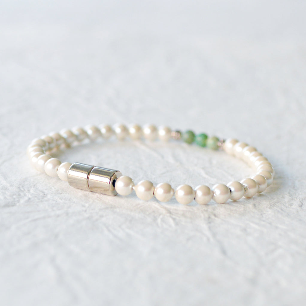Magnetic bracelet handcrafted with cream pearl hematite magnetic beads with african jade gemstone beads in the center. Secured with a strong and easy-to-use magnetic clasp. Wear as a magnetic  bracelet or magnetic ankle bracelet.