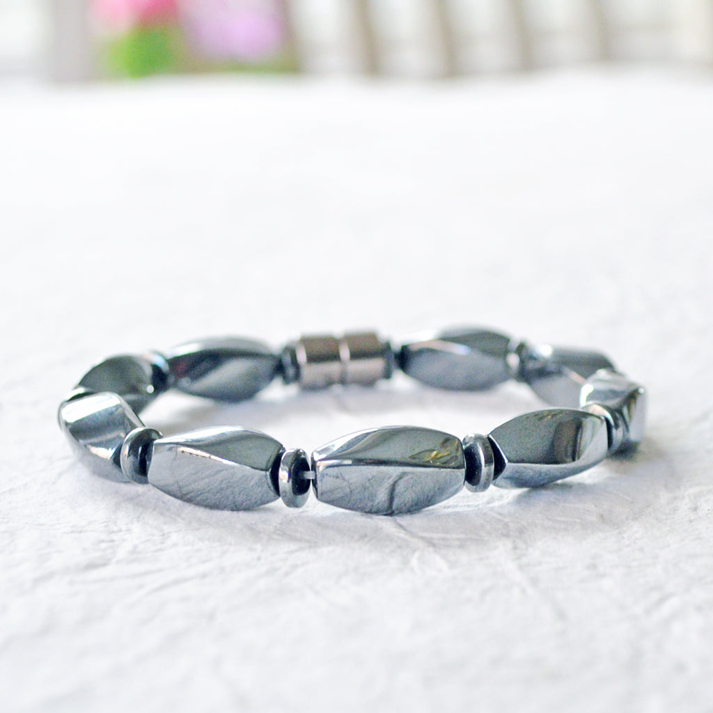 Magnetic therapy bracelet handcrafted with powerful black magnetic hematite beads and secured with a strong magnetic clasp.