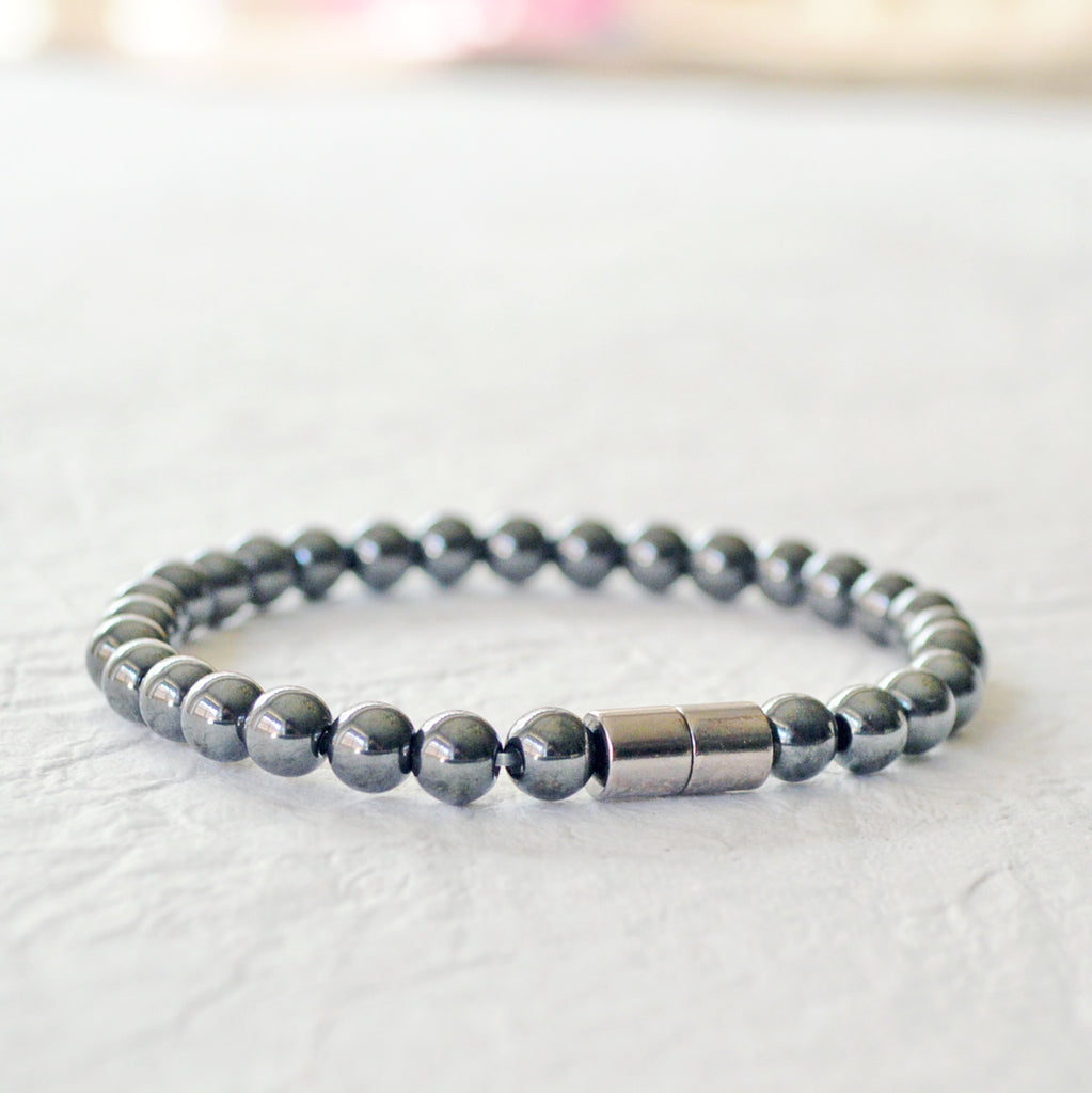 Black magnetic bracelet handcrafted with high power black magnetic hematite beads. Secured with a strong magnetic clasp. Can be worn as a magnetic bracelet or magnetic ankle bracelet.