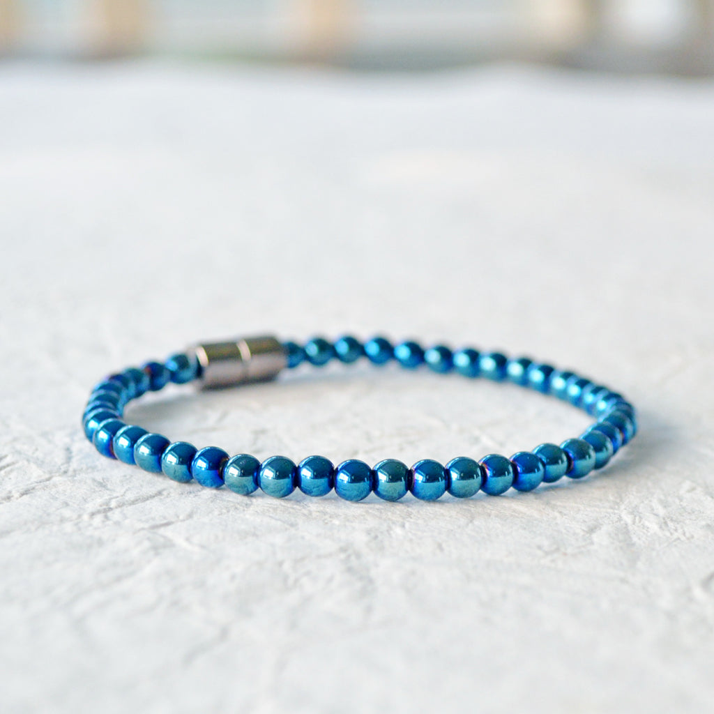 Metallic Magnetic bracelet handcrafted with blue metallic hematite magnetic beads. It is secured with a strong rare earth magnetic clasp. Wear as a magnetic bracelet or ankle bracelet.