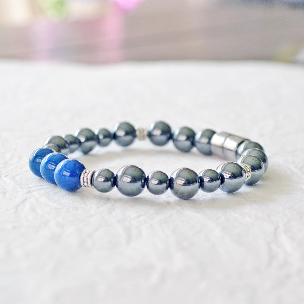 Magnetic pain relief bracelet handcrafted with black high power magnetic hematite beads and blue riverstone beads. It is secured with a strong rare earth magnetic clasp.