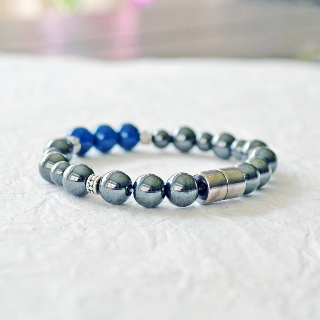 Magnetic pain relief bracelet handcrafted with black high power magnetic hematite beads and blue riverstone beads. It is secured with a strong rare earth magnetic clasp.