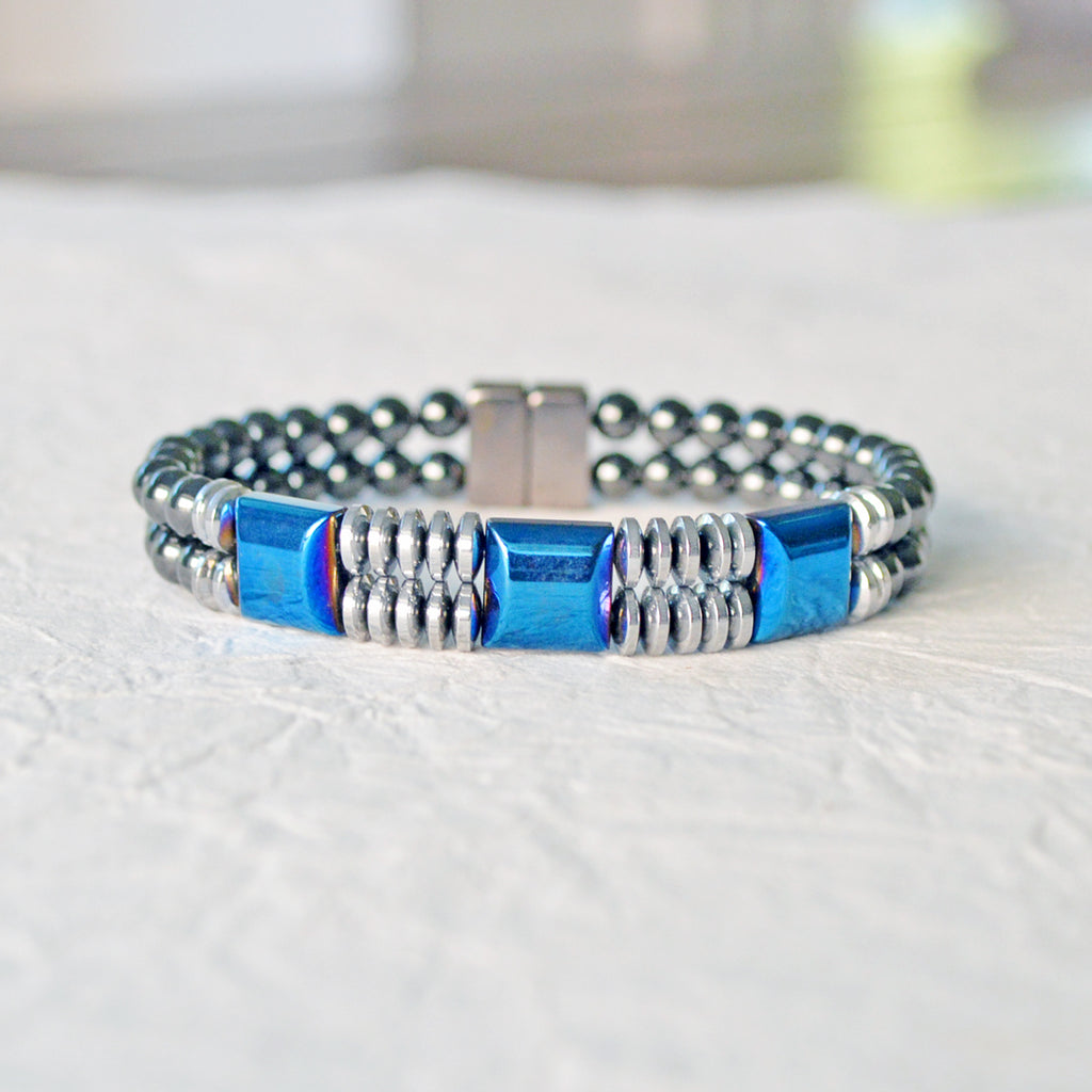 Double strand Magnetic bracelet handcrafted with blue and silver metallic magnetic beads, and black magnetic beads. It is secured with a strong rare earth magnetic clasp.
