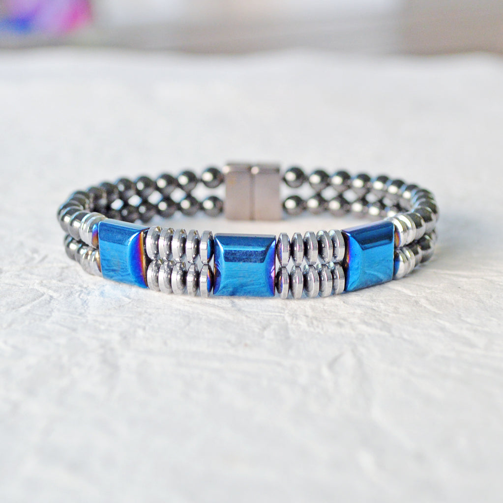 Double strand Magnetic bracelet handcrafted with blue and silver metallic magnetic beads, and black magnetic beads. It is secured with a strong rare earth magnetic clasp.