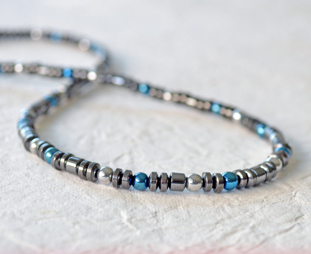 Magnetic necklace for pain handcrafted with black magnetic hematite and blue & silver metallic magnetic hematite beads. Secured with a strong and easy-to-use magnetic clasp.