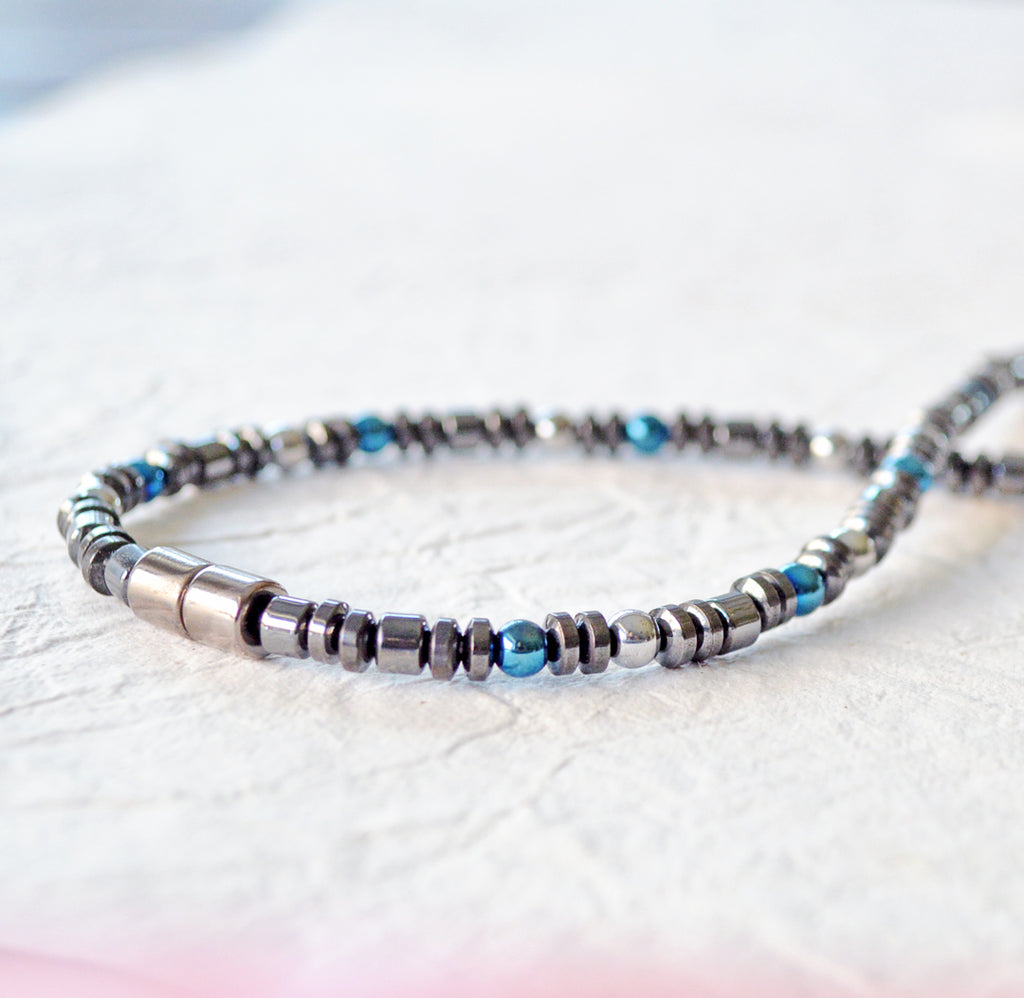 Magnetic necklace for pain handcrafted with black magnetic hematite and blue & silver metallic magnetic hematite beads. Secured with a strong and easy-to-use magnetic clasp.