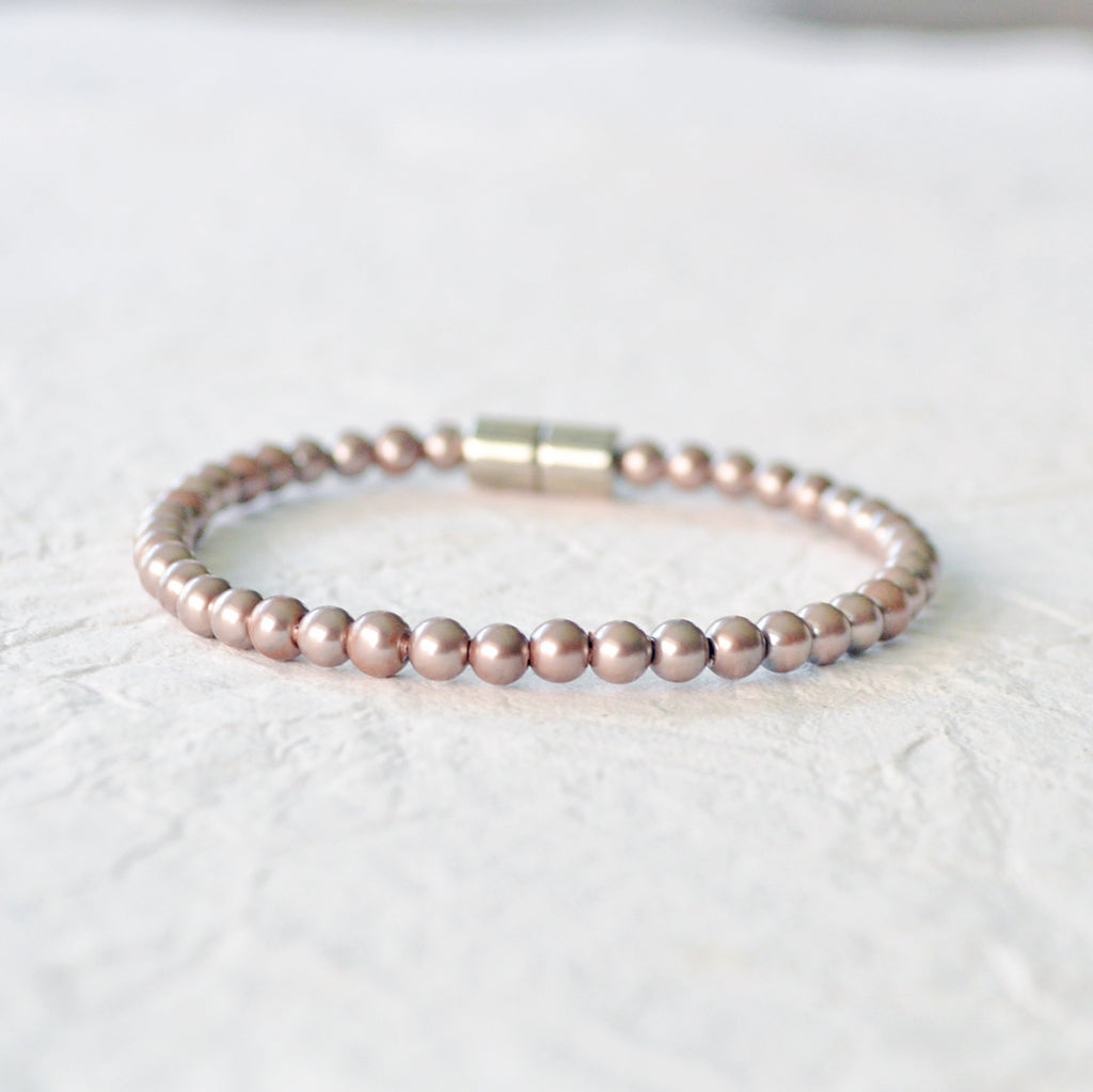 Magnetic bracelet for pain handcrafted with bronze pearl hematite magnetic beads and secured with a strong and easy-to-use rare earth magnetic clasp. It can be worn as a magnetic bracelet or as a magnetic ankle bracelet.