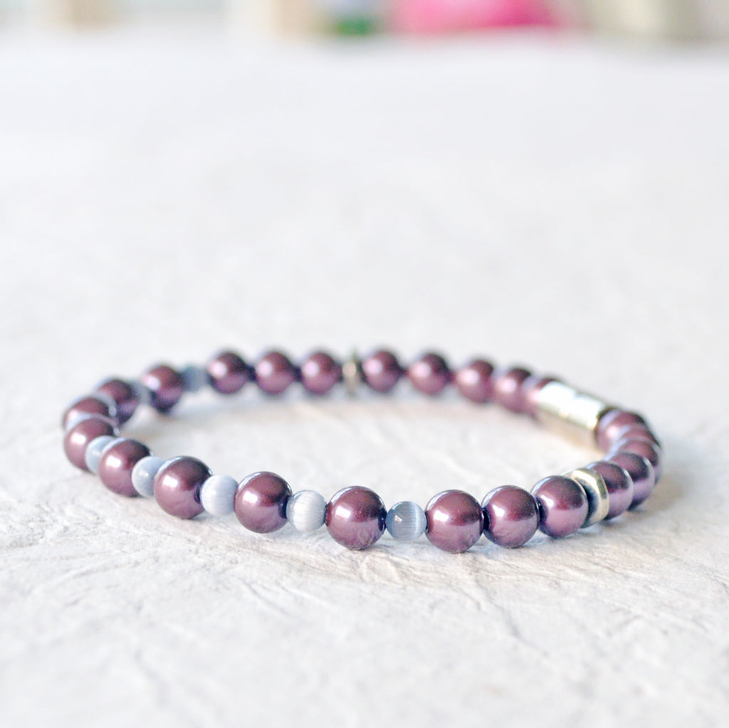 Magnetic bracelet handcrafted with burgundy pearl hematite magnetic beads and grey cat's eye beads. Secured with a strong magnetic clasp. Wear as a magnetic bracelet or magnetic ankle bracelet.