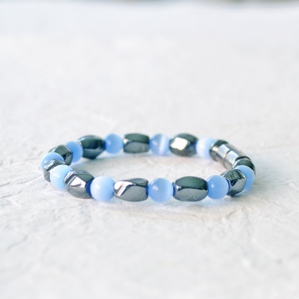 Magnetic bracelet handcrafted with powerful magnetic hematite beads and light blue cat's eye beads. It is secured with a strong magnetic clasp. It can be worn as a magnetic bracelet or magnetic ankle bracelet.