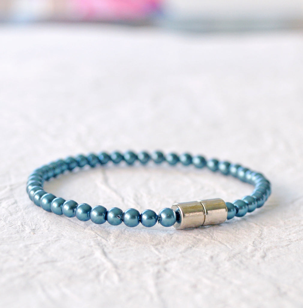 Magnetic bracelet handcrafted with dark teal pearl hematite magnetic beads. Secured with a strong and easy-to-use magnetic clasp. Wear as a magnetic bracelet or magnetic anklet.