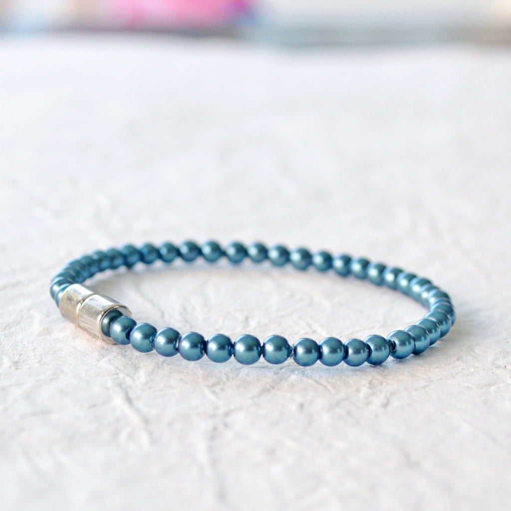 Magnetic bracelet handcrafted with dark teal pearl hematite magnetic beads. Secured with a strong and easy-to-use magnetic clasp. Wear as a magnetic bracelet or magnetic anklet.