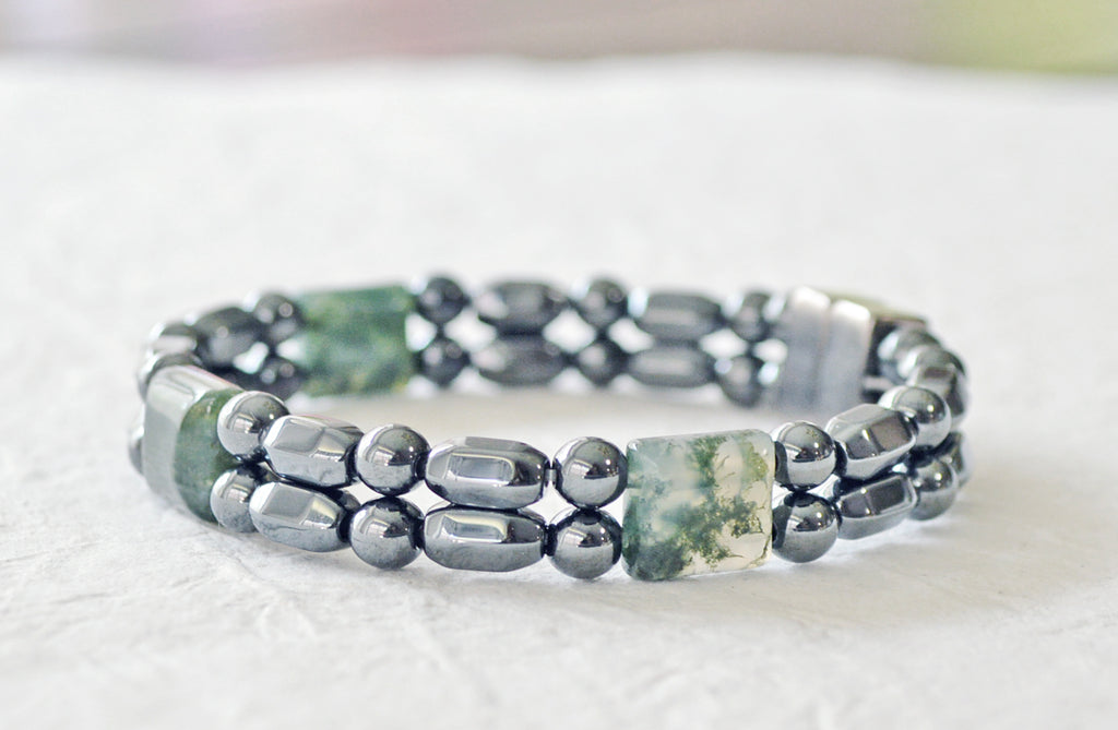 Magnetic bracelet handcrafted with black high power magnetic hematite beads and green moss agate gemstone beads. It is secured with a strong and easy-to-use magnetic clasp.