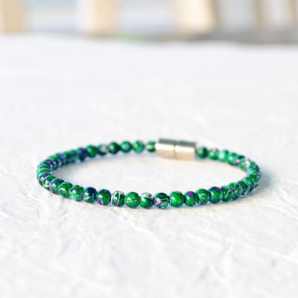 Magnetic bracelet handcrafted with green picasso hematite magnetic beads and secured with a strong magnetic clasp. Wear as a magnetic bracelet or magnetic ankle bracelet.
