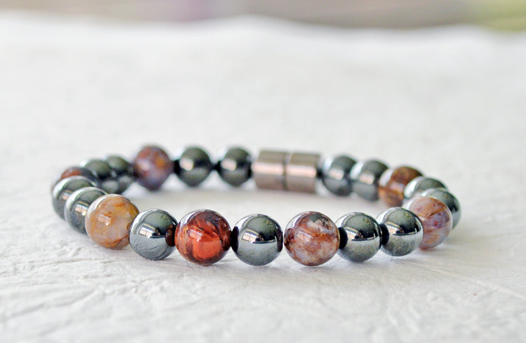 Magnetic bracelet for pain handcrafted with black high power magnetic hematite beads and pietersite emstone beads. It is secured with a strong and easy-to-use magnetic clasp.