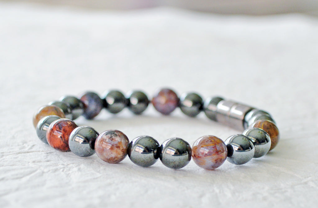 Magnetic bracelet for pain handcrafted with black high power magnetic hematite beads and pietersite emstone beads. It is secured with a strong and easy-to-use magnetic clasp.