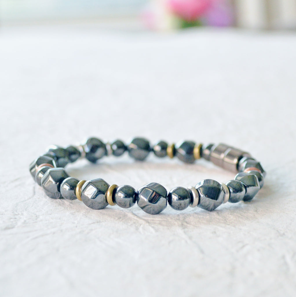 Magnetic bracelet handcrafted with black high power magnetic hematite beads and metal spacer beads. Secured with a strong magnetic clasp.