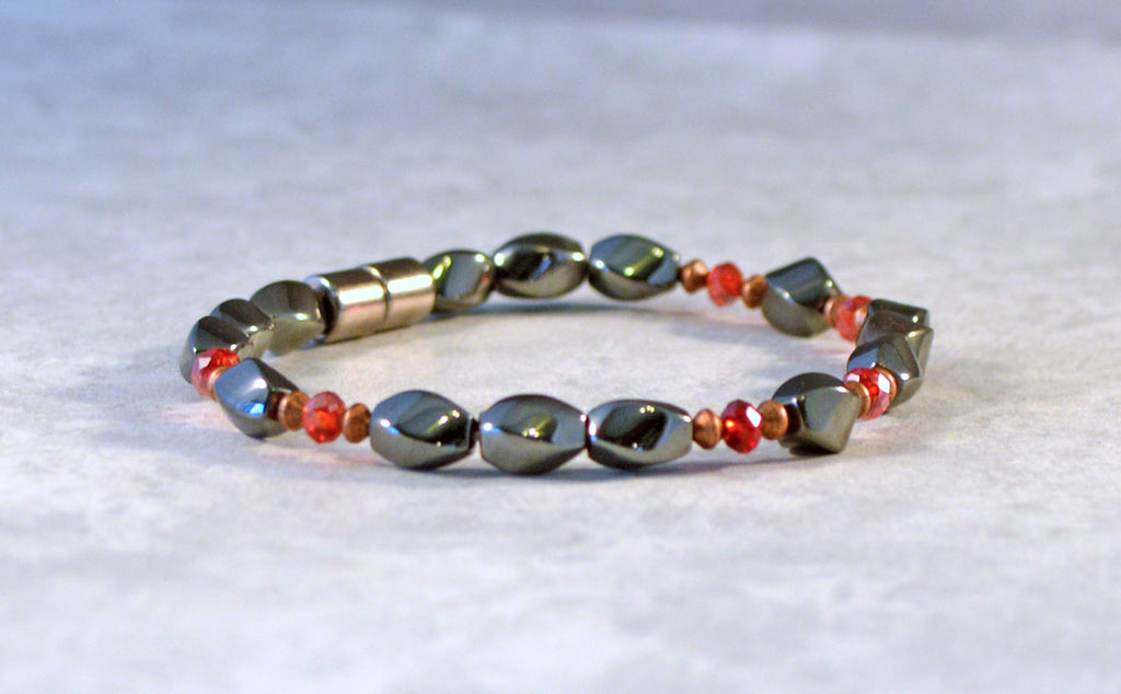 Magnetic bracelet handcrafted with black magnetic hematite beads, red crystal, and antique copper spacer beads. Secured with a strong magnetic clasp. Can be worn as a magnetic bracelet or magnetic ankle bracelet.