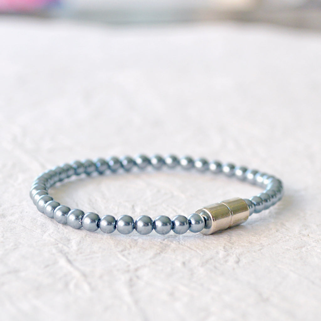 Magnetic bracelet handcrafted with teal pearl hematite magnetic beads. Secured with a strong magnetic clasp. Wear as a magnetic bracelet or magnetic ankle bracelet.