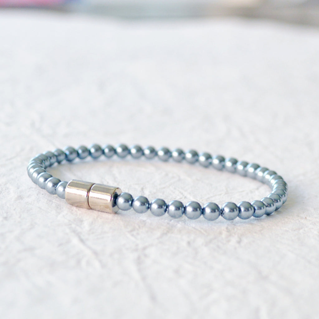 Magnetic bracelet handcrafted with teal pearl hematite magnetic beads. Secured with a strong magnetic clasp. Wear as a magnetic bracelet or magnetic ankle bracelet.