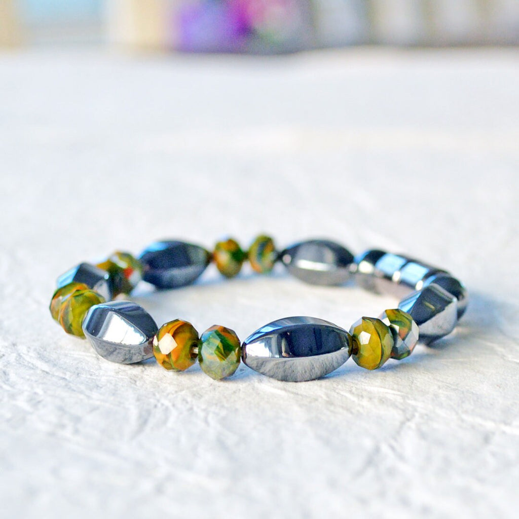 Magnetic bracelet handcrafted with powerful black magnetic hematite beads paired with earthy toned czech glass beads. Secured with a strong and easy-to-use magnetic clasp.