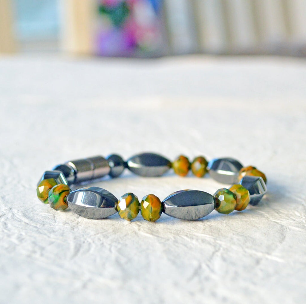 Magnetic bracelet handcrafted with powerful black magnetic hematite beads paired with earthy toned czech glass beads. Secured with a strong and easy-to-use magnetic clasp.