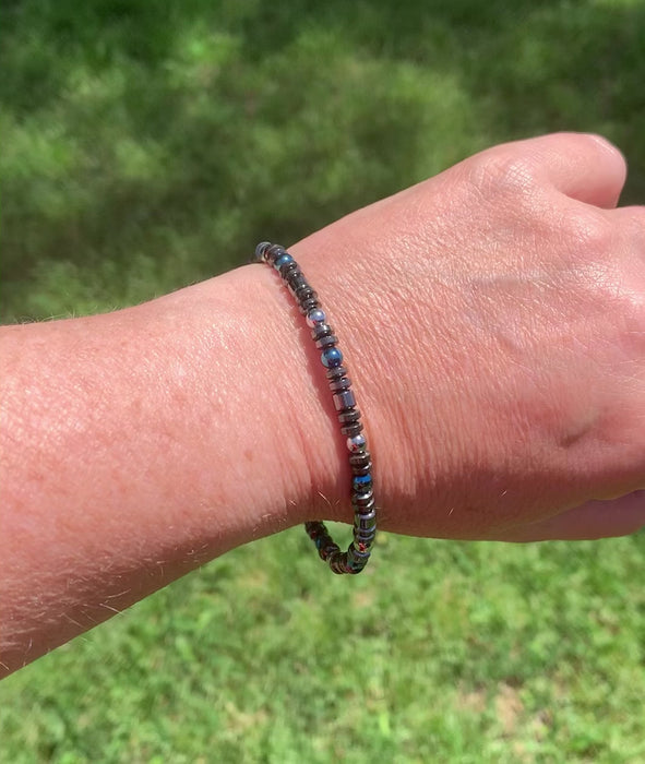 Hematite magnetic bracelet handcrafted with black, silver, and blue magnetic hematite beads. Secured with a strong magnetic clasp. Wear as a magnetic bracelet or magnetic ankle bracelet.
