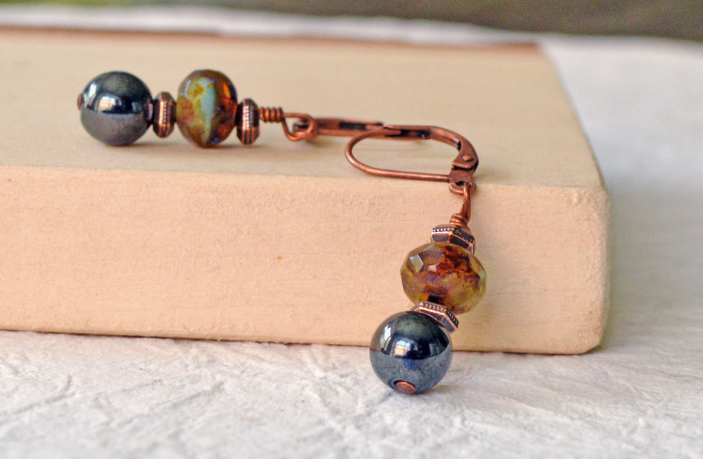 Magnetic bead earrings handcrafted with black high power magnetic hematite beads, czech glass beads, and antique copper spacer beads. The beads all hang from antique copper leverbacks.
