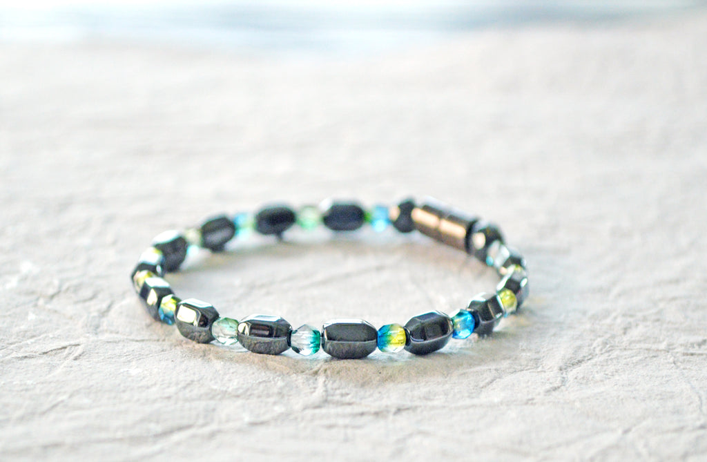 Magnetic bracelet is handcrafted with alternating black high power magnetic hematite beads and blue/green czech glass fire polished beads. It is secured with a strong magnetic clasp and makes a pretty magnetic bracelet or magnetic anklet.